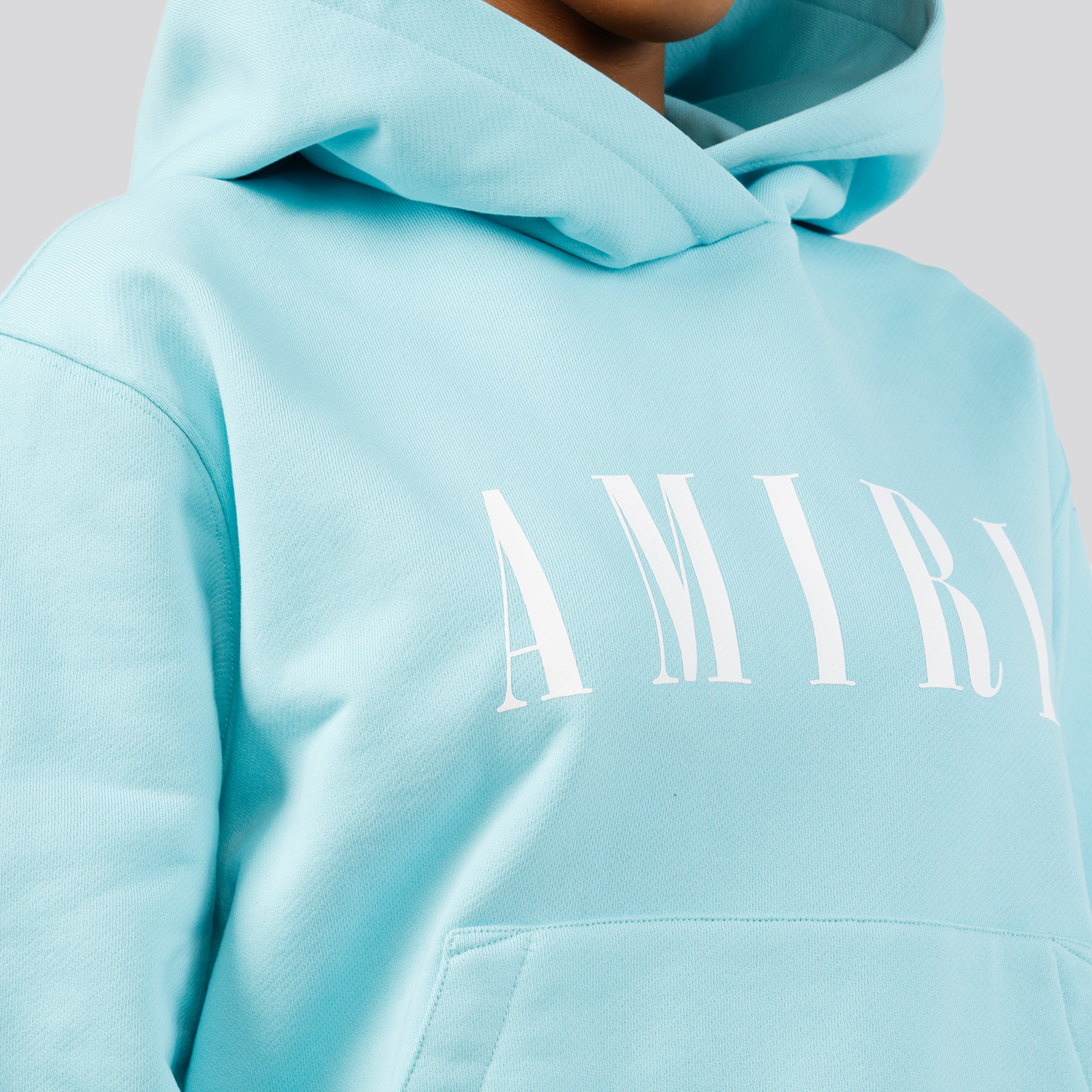 Buzo Celeste AMIRI Logo