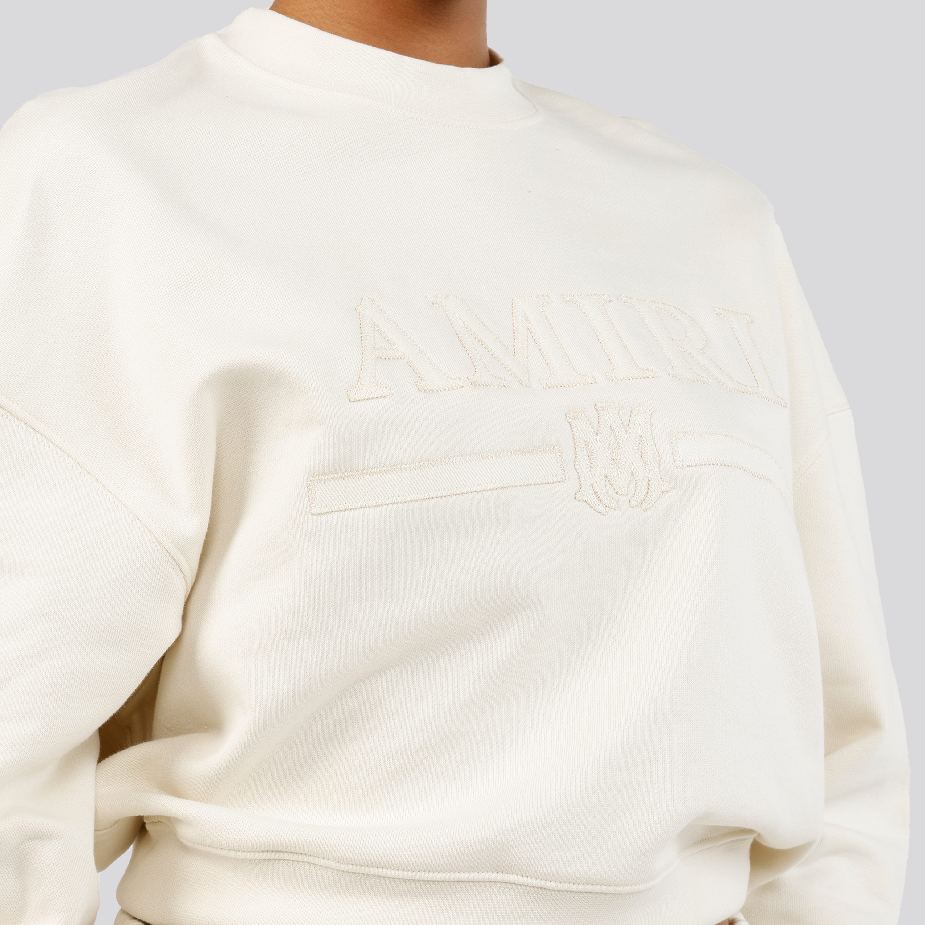 Buzo Crema AMIRI Logo